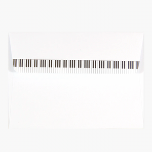 White envelope C6 with piano keys along closure