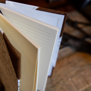 Inside view of the SB Libris half leather journal showing cream lined pages, perfect for journaling or note-taking.