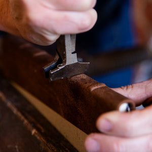 Close-up of traditional moulding raised bands on a leather journal by master bookbinder at SB Libris in Bendigo.