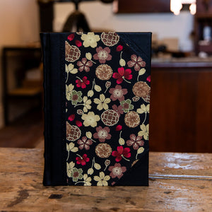 Small SB Libris handbound journal with Japanese floral cover design and traditional black leather corners and spine.