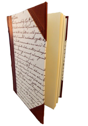 Side view of half leather journal with script sides