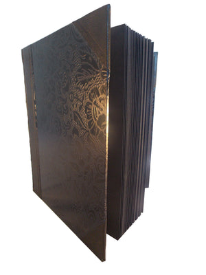 Side view of black leather photo album with Japanese washi sides