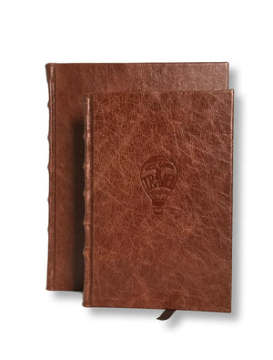 Leather travel journal shown in 2 sizes