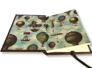Balloon print endpapers inside travel journal
