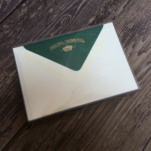 Correspondence cards with dark green lined envelopes