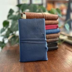 A mini leather wrap style journal in Peacock Blue